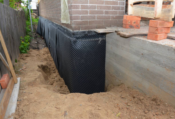 Happy homeowners after waterproofing job in Wilkinson